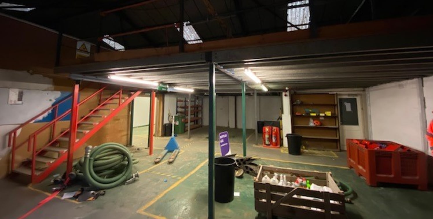 The property comprises a steel portal framed building with block elevations and pitched roof.

The property has a roller shutter door to the front which has been enclosed with a shop display frontage, the property is then laid out as a trade counter...