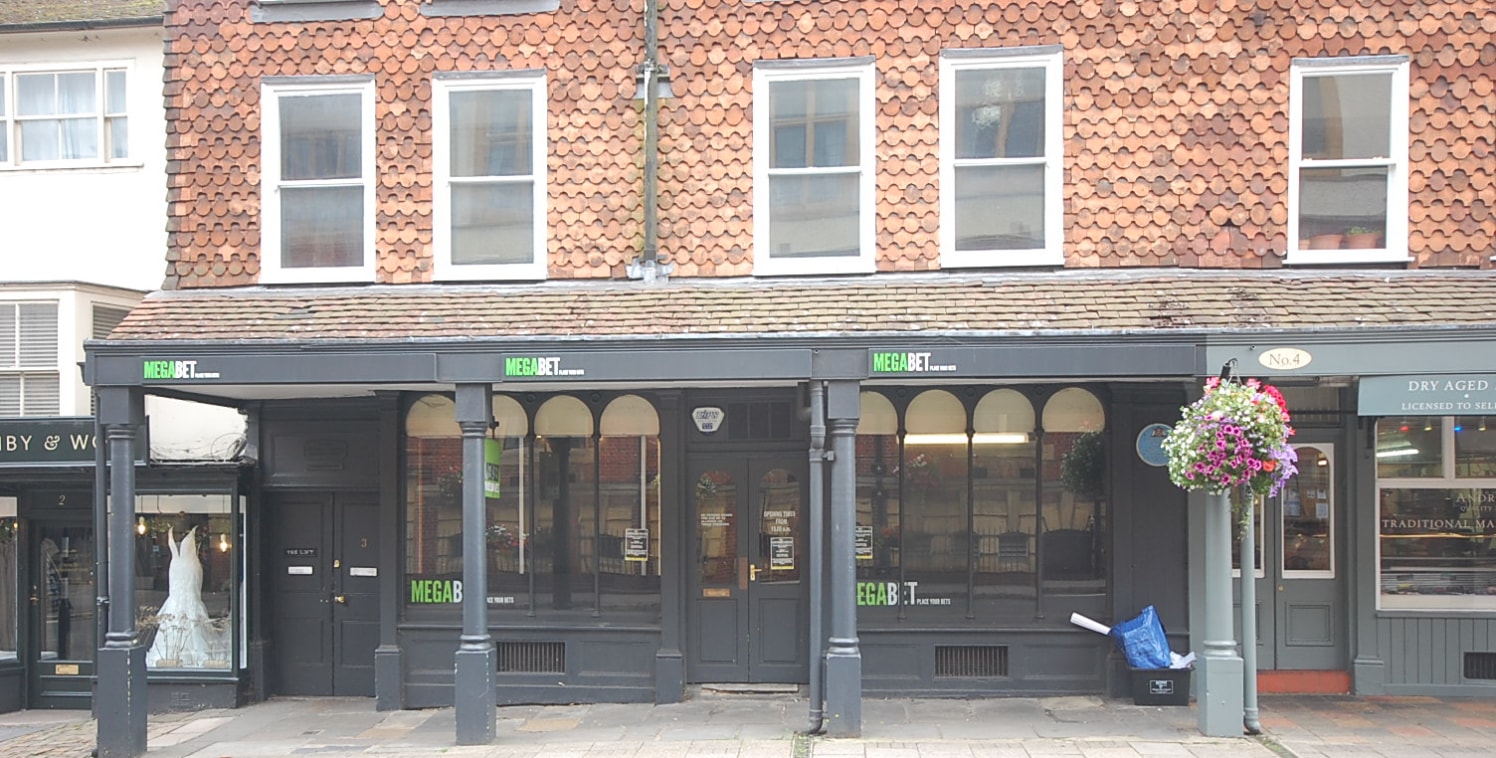 942 sq ft\n\nFORMER BETTING SHOP WITH POTENTIAL FOR RETAIL OR OTHER USES SUBJECT TO PLANNING\n\nThis is a Grade 2 listed building and features a canopy projecting out from the front of the building. The shop has a central doorway with large display w...