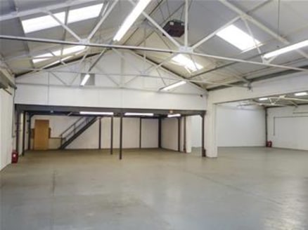 The premises comprise an industrial/warehouse unit of steel portal frame construction with brickwork elevations and a pitched roof. The warehouse area benefits from a clear open plan layout while ancillary offices are located to the first floor level...