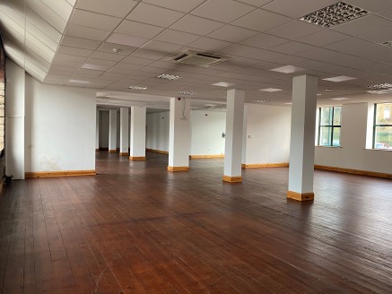 The unit is part of the ground floor of a larger three storey stone-built office/retail property. The ground floor has been split into two retail/showroom or office suites. Internally the vacant unit benefits from open plan space with original featur...