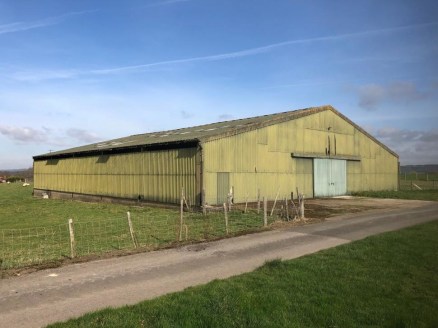 A detached former lambing shed of steel portal frame construction with Prior Approval for conversion into 3 residential dwellings with parking and bike & bin storage. Situated in an isolated yet accessible location with far reaching views from an ele...