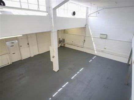 The premises comprise a mid-terrace 1950-60s built warehouse / storage facility constructed of brick elevations to a pitched roof. Access to the warehouse is available via the loading door served by a loading bay....