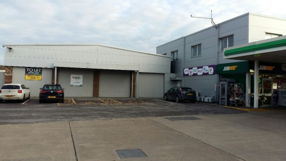 An A1 retail unit of portal frame construction and modern profile sheeting with dedicated parking