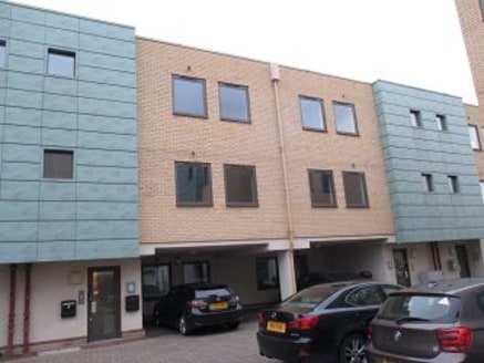 Modern office building on ground and 2 upper floors together with 6 car...
