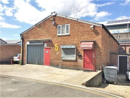 WAREHOUSE / INDUSTRIAL UNIT WITH FIRST FLOOR MEZZANINE & CAR PARKING\n\nAmenities\n\n* First floor mezzanine office\n\n* 2.2m x 5m roller shutter loading door\n\n* Three phase power\n\n* Gas supply\n\n* Skylights\n\n* Strip Lighting\n\n* 2-3 car park...