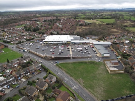 The property comprises a modern ground floor retail unit with sales space to the front and ancillary space to the rear with rear WC. 

The unit benefits from rear servicing via a roller shutter.

Dominant district shopping centre, anchored by a 52,00...