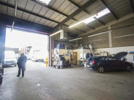 The subject premises comprise of a mid-terrace industrial warehouse unit, primarily of brick and block construction with profile metal cladding to a steel portal frame under a pitched roof. The unit benefits from a maximum eaves height of 6....
