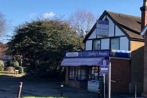 The property is a two-storey 1920s style building with a pitched tiled roof. It comprises a ground floor self-contained convenience store (A1 planning use) with a large shop frontage and a first floor, 2-bedroom residential dwelling accessed via an e...