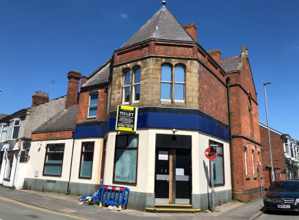 A former bank premises prominently located within the town centre with on-site parking to the rear.