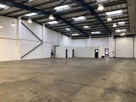 The subject property is a detached industrial unit with two storey ancillary offices. It is constructed on a steel portal frame with a solid concrete floor, blockwork elevations and profile sheet roof incorporating translucent roof lights. The proper...