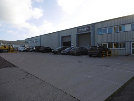 The property provides a modern industrial premises benefiting from a large surfaced and fenced front yard. The unit is accessed via two roller shutter doors to the front elevation and has an internal eaves height of approx. 6.2m (5....