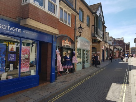 The property occupies a prominent pedestrianised location in an attractive location midway between the Culver and Lion Walk Shopping centres and close to St Johns multi storey car park and comprises a small retail shop with first floor storage.