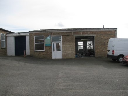 The premises comprise a self-contained concrete frame unit with brick elevations under a corrugated pitched roof. Location The unit is located on the well established Station Road Industrial Estate which is on the southern side of Station Road.