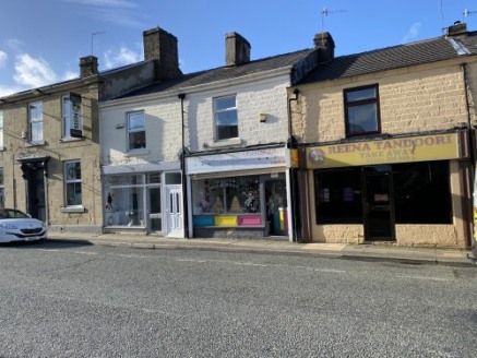 A ground floor retail premises on a popular parade in Oswaldtwistle Town Centre.\n\nThe property has been used as a photography studio for a number of years and comprises of two rooms on the ground floor together with a kitchen extension....