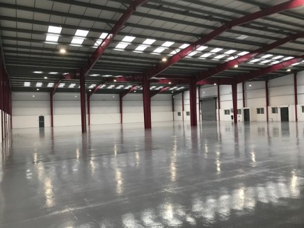 The unit comprises of a detached warehouse of steel portal frame construction with part brick, part profile metal sheet elevations under insulated a pitched...