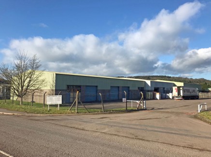 The premises provide industrial/warehouse premises constructed in 1991 with a steel portal frame construction and brick facing elevation with profile steel elevations above.\n\nThe premises benefit from an eaves height of 6.1m (20'), clear internal h...