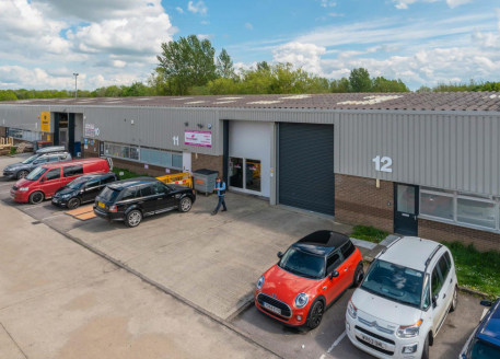 Refurbished industrial/warehouse unit of concrete frame construction under insulated pitched roof incorporating rooflights. 4.61m (15') minimum internal eaves height. Painted concrete floor, single phase electricity, new electrically operated roller...