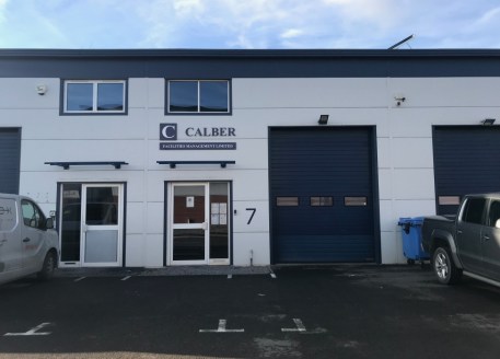 The property comprises a mid-terrace industrial warehouse unit of steel frame constructions with clad elevations beneath a profiled sheet roof. The accommodation provides ground floor industrial warehouse space with a full width mezzanine floor to th...