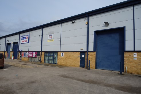 The premises comprise of two purpose built steel portal framed units, clad in profile steel, above a brick cavity wall. The eaves height is circa 7 metres, and there is a large communal yard with parking.