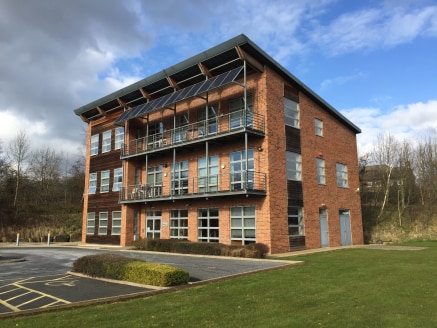 The property comprises a bespoke three storey detached office building of steel portal frame construction with brickwork cladding and architectural timber cladding, beneath a mono-pitched roof.

Internally, the accommodation is arranged on three leve...