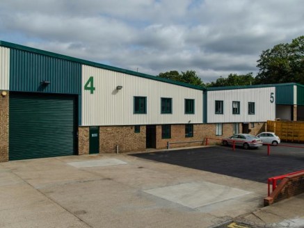 The property comprises an end of terrace warehouse unit with ancillary ground and first floor offices. The unit provides 4.75m clear internal eaves height, a single loading door, and translucent roof lights....
