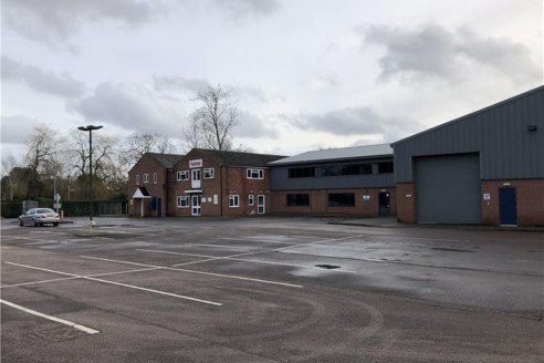 The property comprises a small industrial estate with a mix of industrial, showroom and business premises numbering 17 units of varying size and type and set on a site of approximately 4.2 acres. To the centre of the estate is a large surfaced car .....