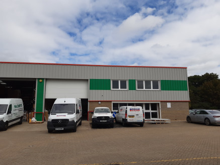 A new end of terrace warehouse / industrial unit constructed of steel portal frame with brick/block elevations at ground level and coated steel cladding above and on the roof.

There is a small office at ground and first floor.