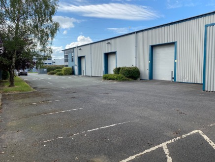 The unit is detached and rectangular in shape, providing car parking to the front and servicing/HGV access to one side. The unit is fully ring fenced with palisade security fencing.
