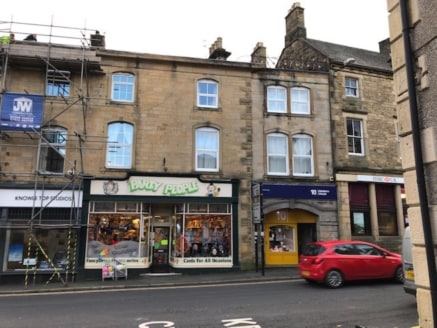 The property is a large, prominent and well maintained 3 storey building in Clitheroe town centre. The ground floor has been split to create 2 adjoining retail units with residential accommodation above....