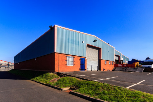 The unit is an end single terrace bay industrial unit of steel portal frame construction with brick infill and part brick an profile metal sheet cladding, with a pitched lined roof incorporating translucent lights. The unit benefits from forecourt ca...