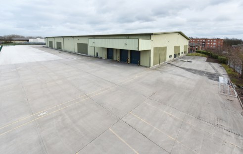 Profile metal clad elevations. Steel portal frame construction. 10.24m eaves height. 6 Level acces loading doors. Ground floor offices. Up to 499 kVa powercapacity. Secure self-contained site.