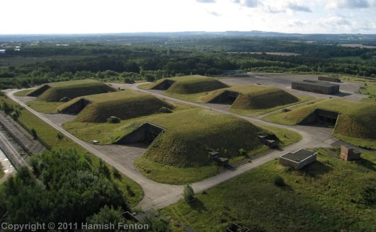 The buildings comprise the former nuclear missile bunkers for the former Greenham Common Airbase. 

The bunkers are constructed of concrete with steel doors and are considered to be highly secure. They measure 40.9m long x 4.86m width x 3.92m height...