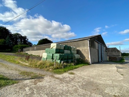 The property comprises a Portal frame building with double doors at the end, lighting, eaves height of 5m and single phase power.

To the south side there is a yard area which can be used for storage / parking etc.