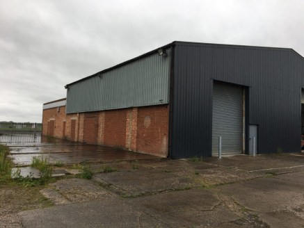 The property comprises a warehouse which is of portal framed construction with part solid elevations and part insulated cladding to the elevations and pitched roof. The warehouse is open plan in layout and benefits from an office to the rear which ha...