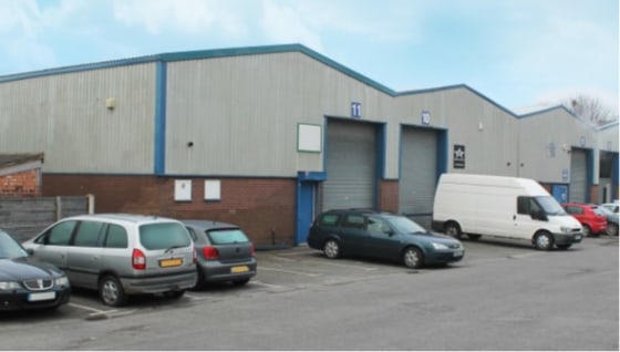 Steel portal frame construction. Approximate eaves height 5.2m (16.11 ft). Breeze block walls and concrete floors. Roller shutter door access. Toilet facilities. Lighting in warehouse / industrial area. Car parking. Established industrial location. C...