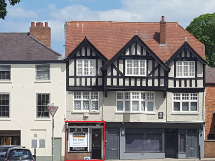 A ground floor retail unit located in a prominent position fronting the main A40 which is a main arterial route into Worcester city centre.

Vacant ground floor retail unit with an occupied two bedroom flat above.