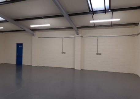 The property occupies a mid-terrace position and was constructed during the 1980's. Internally, the property benefits from clear workshop/warehouse space with integral offices, kitchen and W.C....