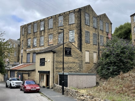 The property comprises a four-storey mill of stone construction under a multi-pitch slate roof providing extensive accommodation having multi-level access points. The premises form part of a larger mill complex known as Mount Pleasant Mills, which is...