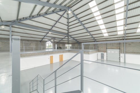 The property comprises a detached industrial property of steel frame construction with brick elevations with approximately 29 parking spaces bays to the front and a shared yard to the rear. 

 

The property has open plan cellular offices to the grou...