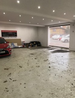 The premises is set back from the main high road and is approached through a walkway with vehicular  access via a rear car park.

The property is arranged to provide offices to the front and storage/workshop to the rear benefiting from electric shutt...