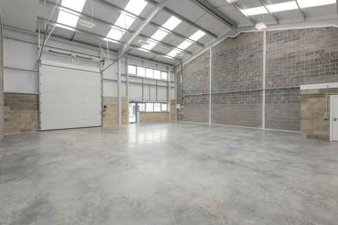 DESCRIPTION:\n\nUnit 4 is an attractive mid terrace industrial/warehouse unit of steel portal frame construction with block/metal clad elevations under an insulated roof. The property benefits from three phase power, high bay lighting an electronic a...