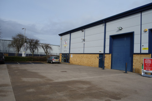 The premises comprise purpose-built, steel portal framed unit, clad in profile steel, above a brick cavity wall. 

The eaves height is circa 7 metres, and there is a large communal yard with parking.