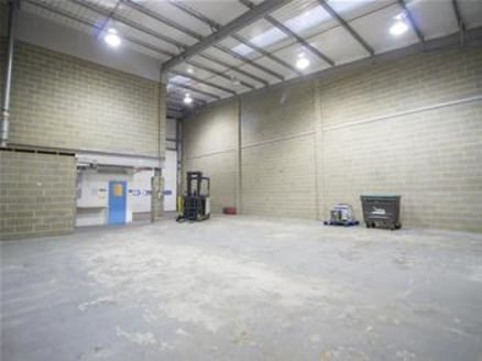 The property comprises a modern steel portal framed mid-terraced warehouse/storage unit constructed in approximately 2006 of part blockwork elevations covered with profile sheet metal cladding to a mono pitched roof. The warehouse also benefits from...