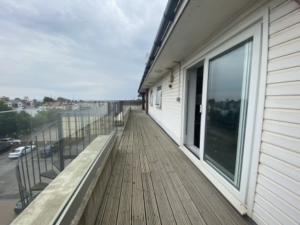 - Top floor with balcony 

- Bright, open plan space

- 3 off street parking spaces included