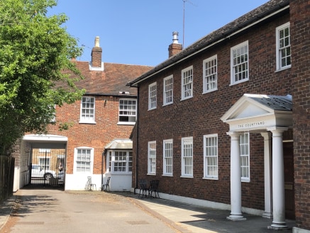 The entire property comprises a Grade II listed dental practice to the front with access from London Street and a mock Georgian office building with associated car parking to the rear. In addition to<br>the car parking area, there is a parcel of land...