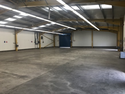 The property comprises a modern workshop/storage unit of steel frame construction with insulated profile sheet walls and roof. The floor is concrete and has an eaves height of approximately 3.8m. There is three phase electricity and strip fluorescent...