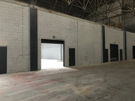 The premises forms a large industrial/warehouse which provides excellent storage/production space benefitting from the following specification:

* Average Clear Headroom 9.5m (31ft)

* Solid Concrete Floor

* Drive in roller shutter loading doors

*...