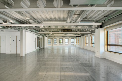 28 Commercial Street is a striking newly built office block which forms part of the Toynbee Hall complex which extends back from Commercial Street accommodating an on-site café, courtyard seating and the public open space of Mallon Gardens. 

The ava...