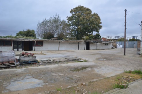 The open storage yard, previously used as a builders merchants, is hard standing and serviced.

The total site area is approximately 0.327 acres.