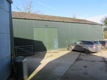 STORAGE BARN / INDUSTRIAL UNIT - EXCELLENT ROAD LINKS TO THE A24 | A steel portal framed barn with steel cladding and partial block walls under a pitched sheeted roof. Externally the property has a good-sized forecourt area providing parking and faci...